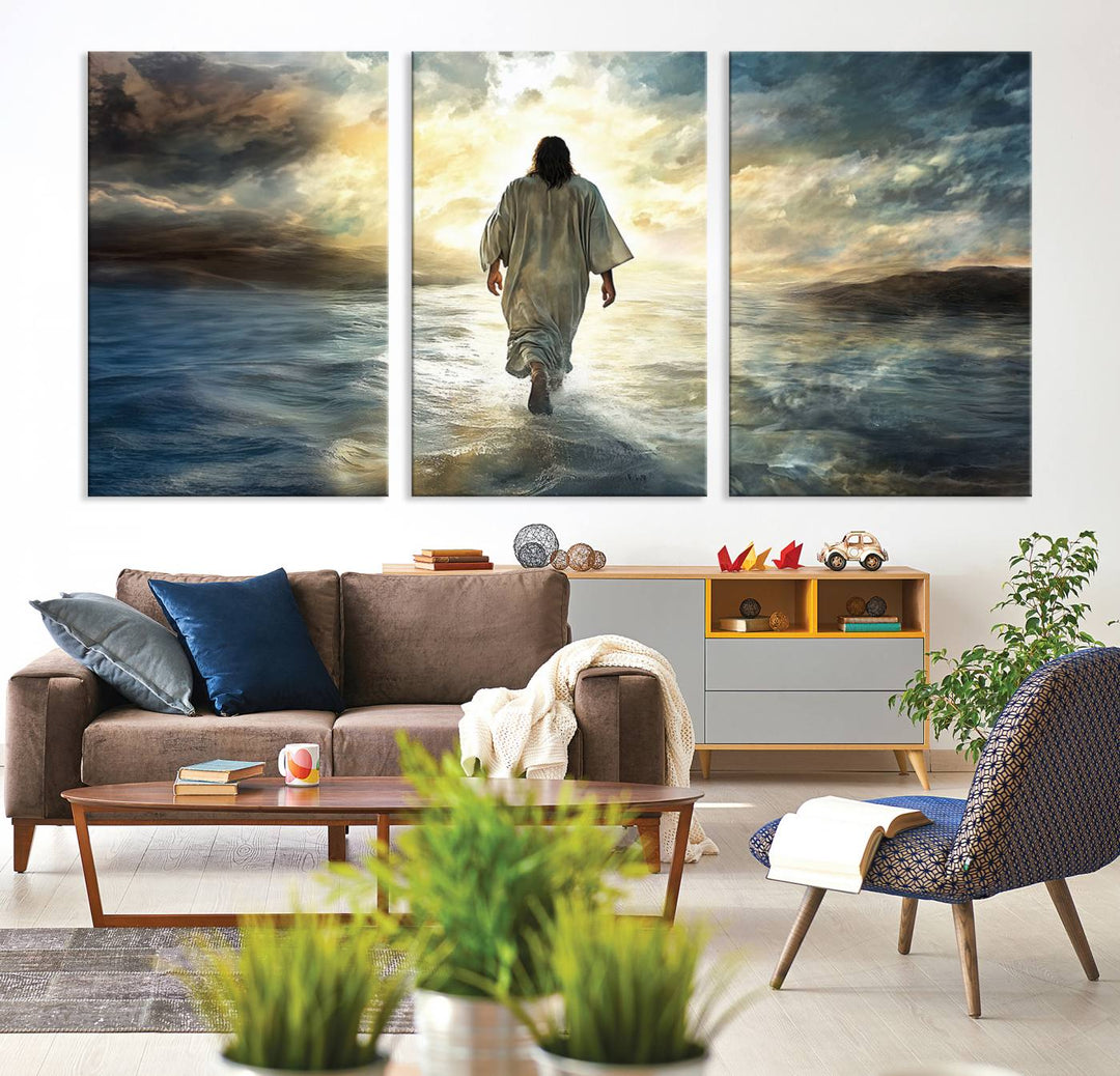 The Jesus Walking on Water Wall Art, a captivating triptych canvas print, showcases a person walking on water beneath dramatic clouds. This ready-to-hang piece seamlessly combines faith and style for your Christian home decor.