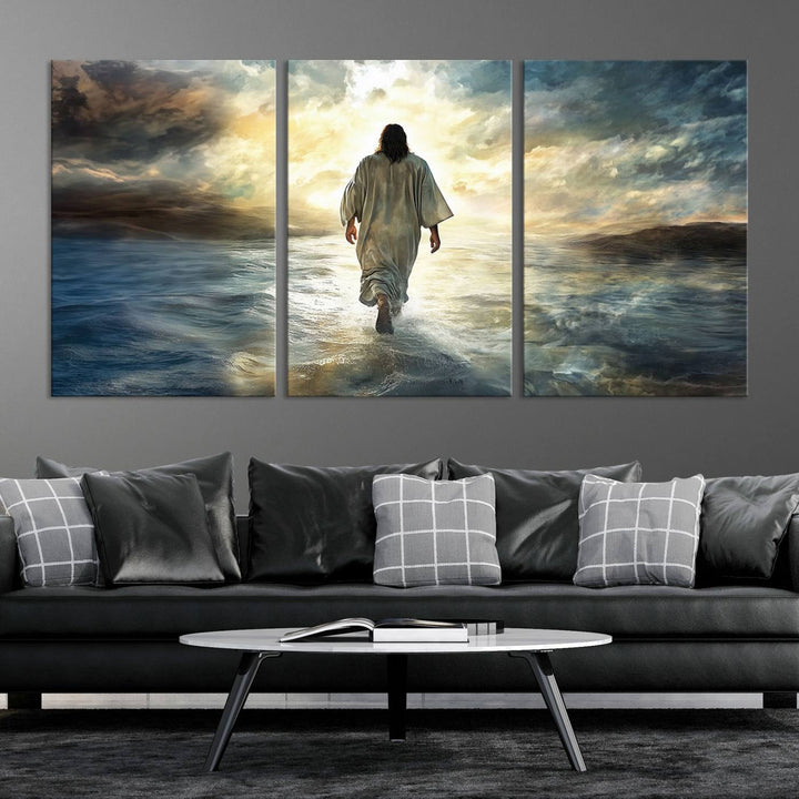 The Jesus Walking on Water Wall Art, a captivating triptych canvas print, showcases a person walking on water beneath dramatic clouds. This ready-to-hang piece seamlessly combines faith and style for your Christian home decor.