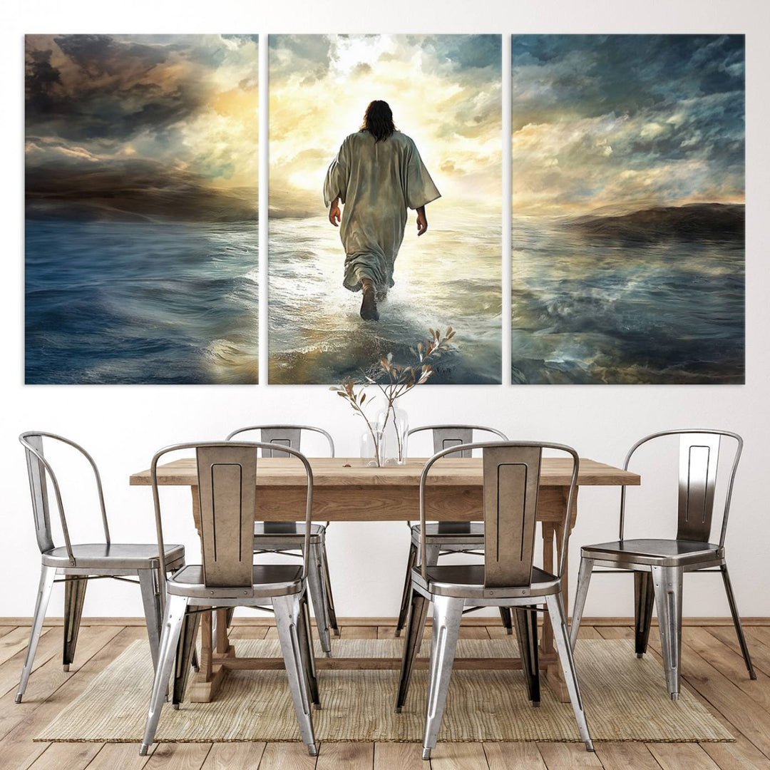 The Jesus Walking on Water Wall Art, a captivating triptych canvas print, showcases a person walking on water beneath dramatic clouds. This ready-to-hang piece seamlessly combines faith and style for your Christian home decor.