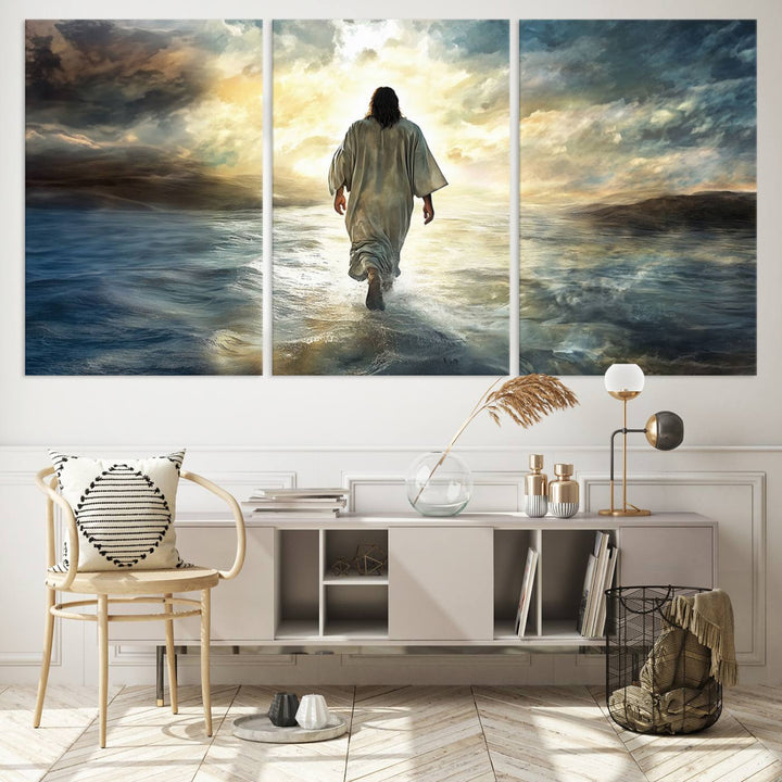 The Jesus Walking on Water Wall Art, a captivating triptych canvas print, showcases a person walking on water beneath dramatic clouds. This ready-to-hang piece seamlessly combines faith and style for your Christian home decor.