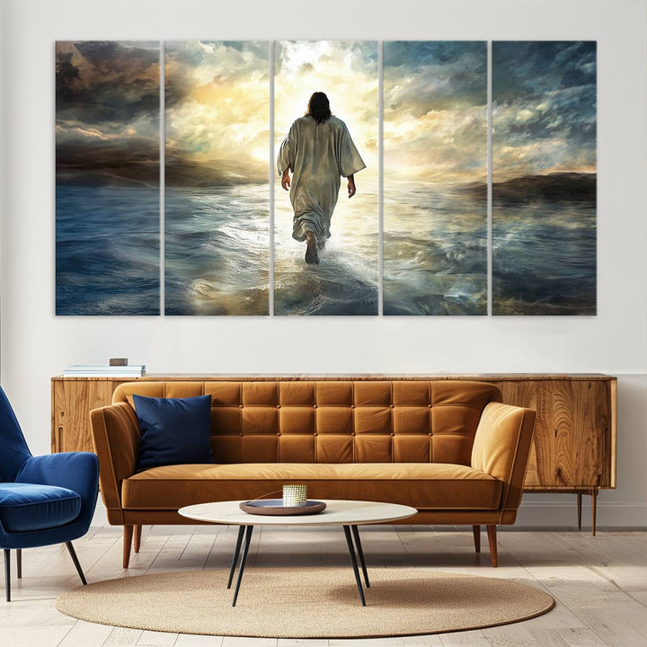 The Jesus Walking on Water Wall Art, a captivating triptych canvas print, showcases a person walking on water beneath dramatic clouds. This ready-to-hang piece seamlessly combines faith and style for your Christian home decor.