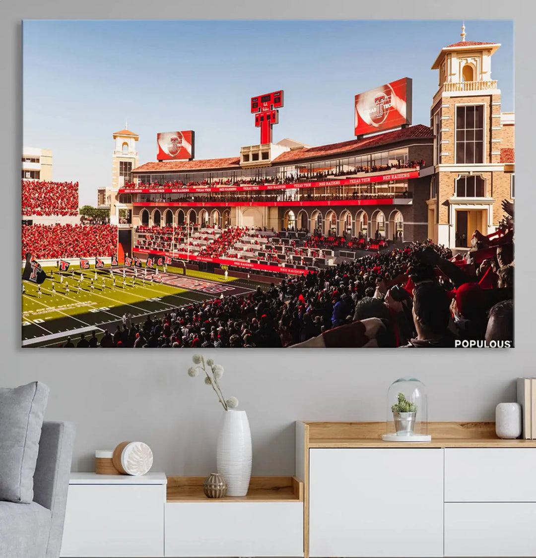 A 3-panel large canvas print of the Jones AT&T Stadium, showcasing vibrant Texas Tech Red Raiders fans in red and white, is elegantly displayed.