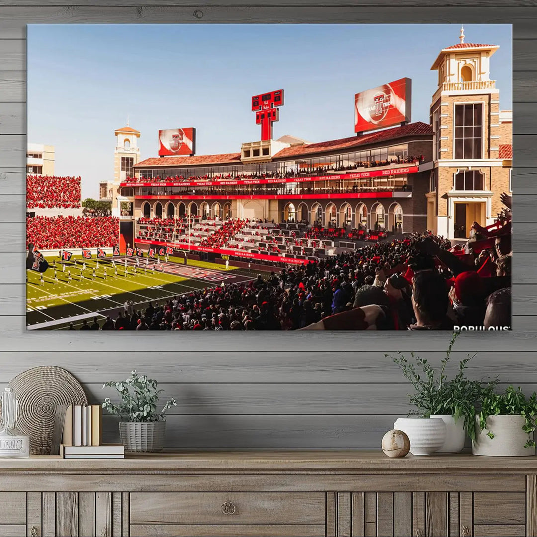 A 3-panel large canvas print of the Jones AT&T Stadium, showcasing vibrant Texas Tech Red Raiders fans in red and white, is elegantly displayed.