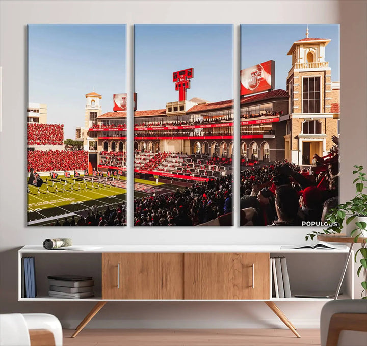 A 3-panel large canvas print of the Jones AT&T Stadium, showcasing vibrant Texas Tech Red Raiders fans in red and white, is elegantly displayed.