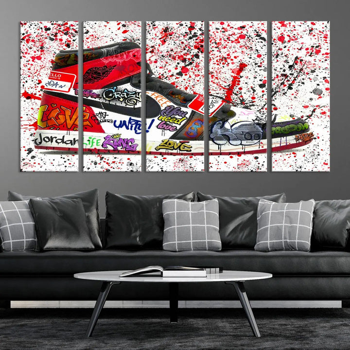 A large triptych mural titled "Jordan Shoes Graffiti Wall Art Canvas Print - Jordan Graffiti Canvas Wall Art" features images of Jordan Shoes against a splattered paint background that resembles graffiti, making it an ideal choice for sneakerheads and urban art lovers.