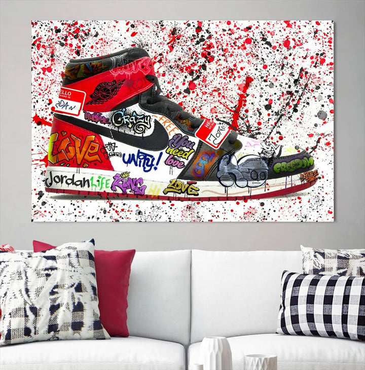 A large triptych mural titled "Jordan Shoes Graffiti Wall Art Canvas Print - Jordan Graffiti Canvas Wall Art" features images of Jordan Shoes against a splattered paint background that resembles graffiti, making it an ideal choice for sneakerheads and urban art lovers.