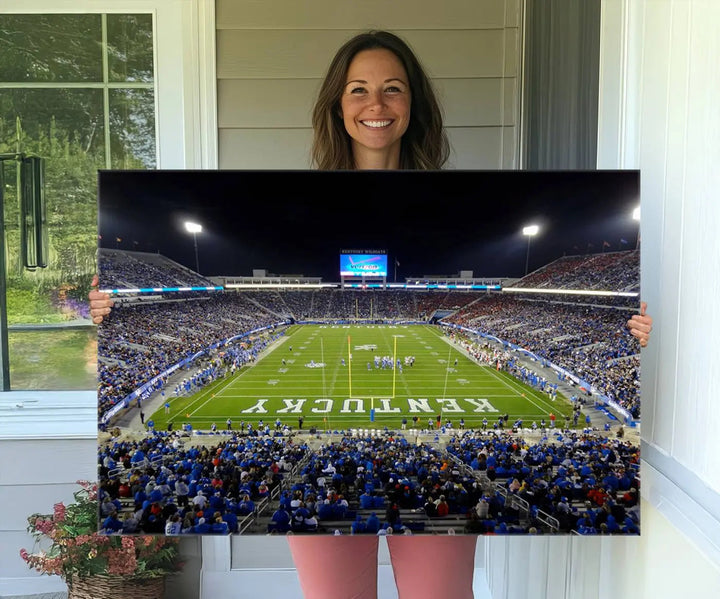 A sunset football game at Kroger Field in Lexington, with Kentucky showcased on the field, transforms into a stunning wall art piece. This premium canvas artwork, handmade in the USA, vividly encapsulates the vibrant energy and excitement of this memorable sports moment.