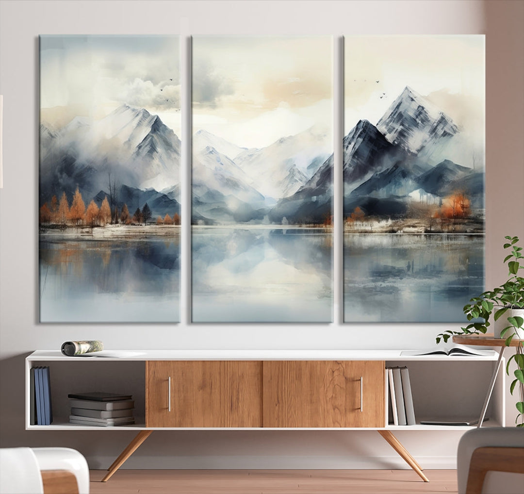 The Lake Mountain Abstract Wall Art, featuring a serene portrayal of mountains and a tranquil lake with autumn trees, is displayed on museum-quality canvas and enhanced by UV-protective coating.