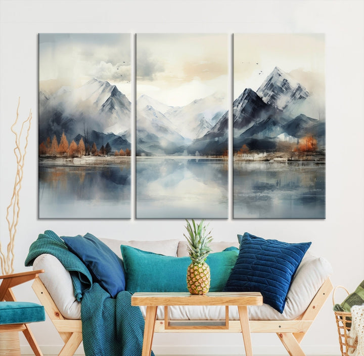 The Lake Mountain Abstract Wall Art, featuring a serene portrayal of mountains and a tranquil lake with autumn trees, is displayed on museum-quality canvas and enhanced by UV-protective coating.