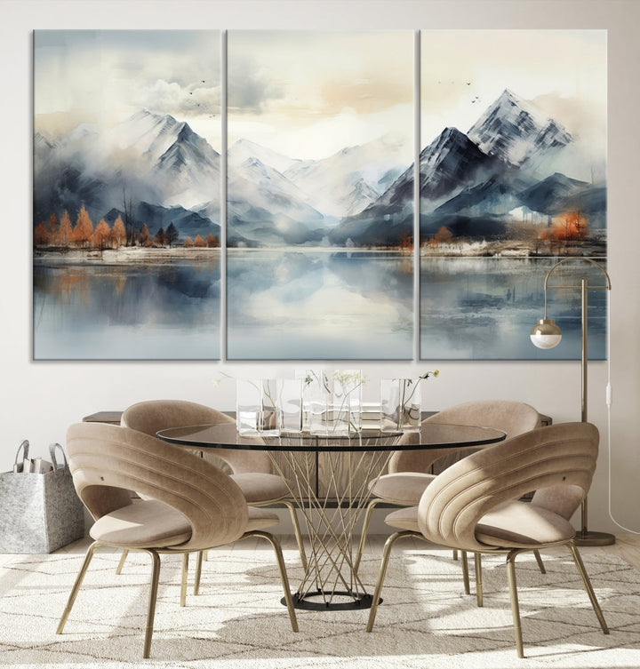 The Lake Mountain Abstract Wall Art, featuring a serene portrayal of mountains and a tranquil lake with autumn trees, is displayed on museum-quality canvas and enhanced by UV-protective coating.