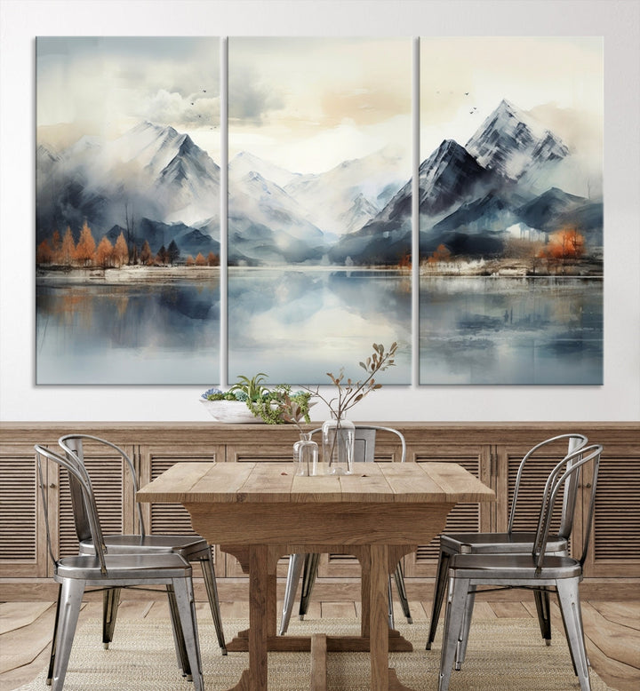 The Lake Mountain Abstract Wall Art, featuring a serene portrayal of mountains and a tranquil lake with autumn trees, is displayed on museum-quality canvas and enhanced by UV-protective coating.