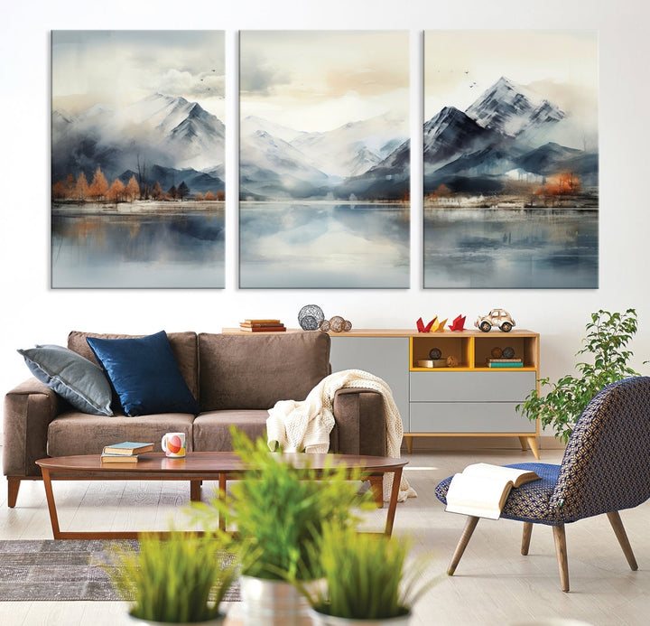 The Lake Mountain Abstract Wall Art, featuring a serene portrayal of mountains and a tranquil lake with autumn trees, is displayed on museum-quality canvas and enhanced by UV-protective coating.