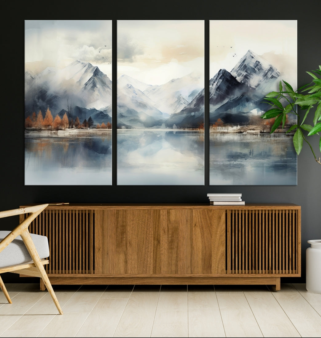 The Lake Mountain Abstract Wall Art, featuring a serene portrayal of mountains and a tranquil lake with autumn trees, is displayed on museum-quality canvas and enhanced by UV-protective coating.