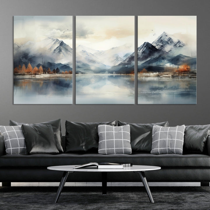 The Lake Mountain Abstract Wall Art, featuring a serene portrayal of mountains and a tranquil lake with autumn trees, is displayed on museum-quality canvas and enhanced by UV-protective coating.