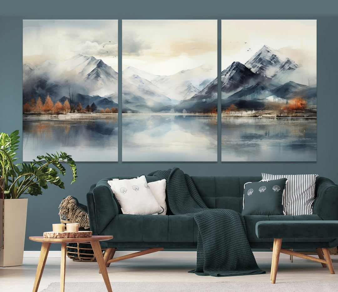 The Lake Mountain Abstract Wall Art, featuring a serene portrayal of mountains and a tranquil lake with autumn trees, is displayed on museum-quality canvas and enhanced by UV-protective coating.