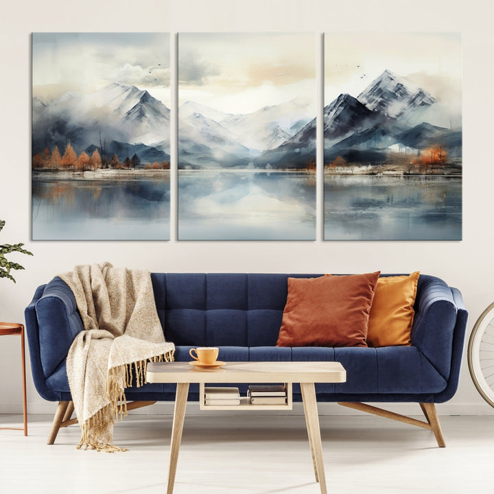 The Lake Mountain Abstract Wall Art, featuring a serene portrayal of mountains and a tranquil lake with autumn trees, is displayed on museum-quality canvas and enhanced by UV-protective coating.