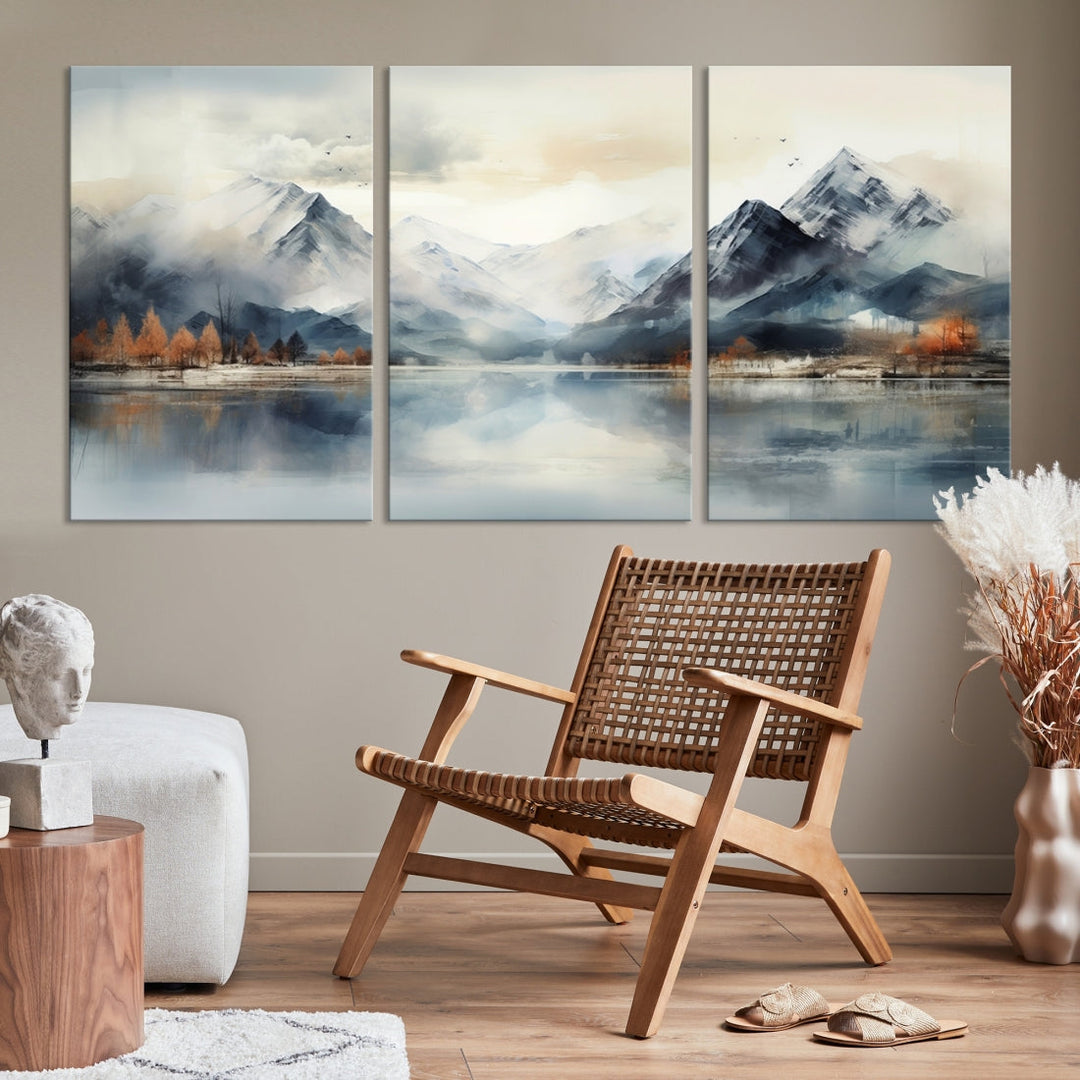 The Lake Mountain Abstract Wall Art, featuring a serene portrayal of mountains and a tranquil lake with autumn trees, is displayed on museum-quality canvas and enhanced by UV-protective coating.