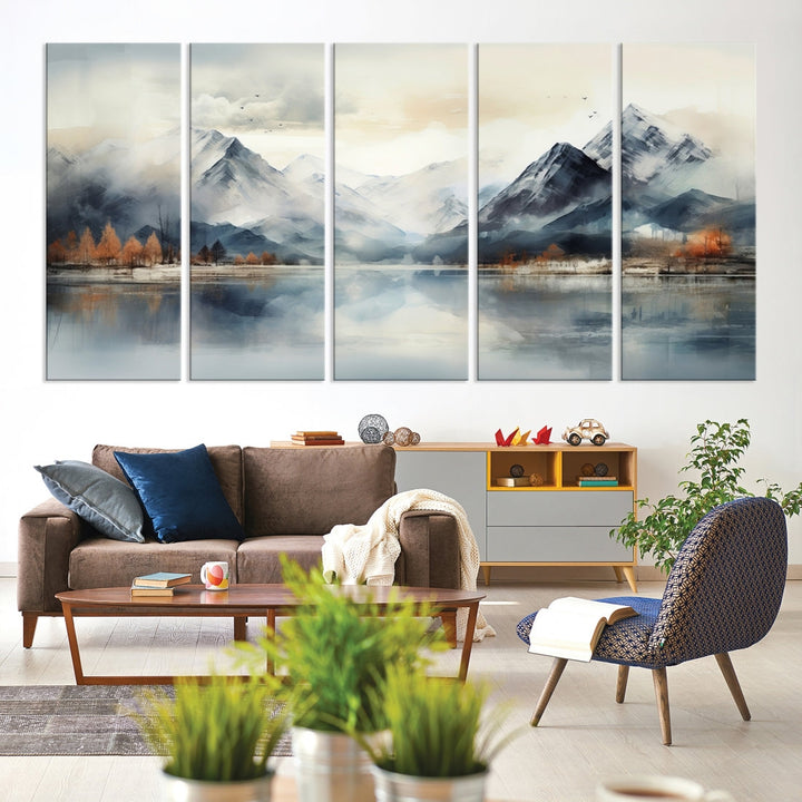 The Lake Mountain Abstract Wall Art, featuring a serene portrayal of mountains and a tranquil lake with autumn trees, is displayed on museum-quality canvas and enhanced by UV-protective coating.