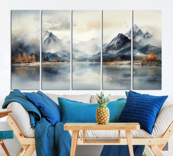 The Lake Mountain Abstract Wall Art, featuring a serene portrayal of mountains and a tranquil lake with autumn trees, is displayed on museum-quality canvas and enhanced by UV-protective coating.