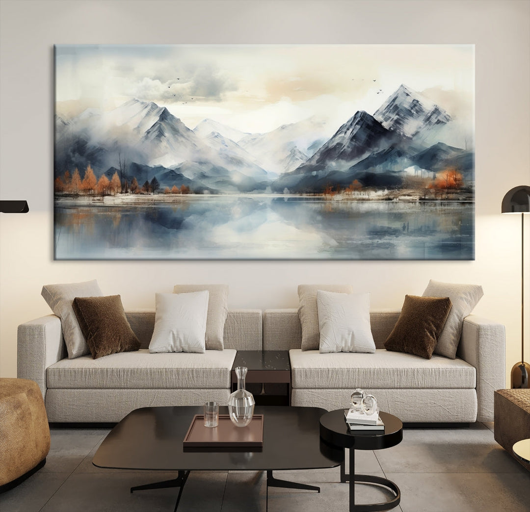 The Lake Mountain Abstract Wall Art, featuring a serene portrayal of mountains and a tranquil lake with autumn trees, is displayed on museum-quality canvas and enhanced by UV-protective coating.