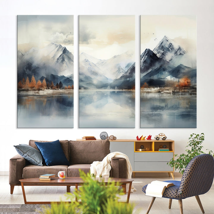 The Lake Mountain Abstract Wall Art, featuring a serene portrayal of mountains and a tranquil lake with autumn trees, is displayed on museum-quality canvas and enhanced by UV-protective coating.