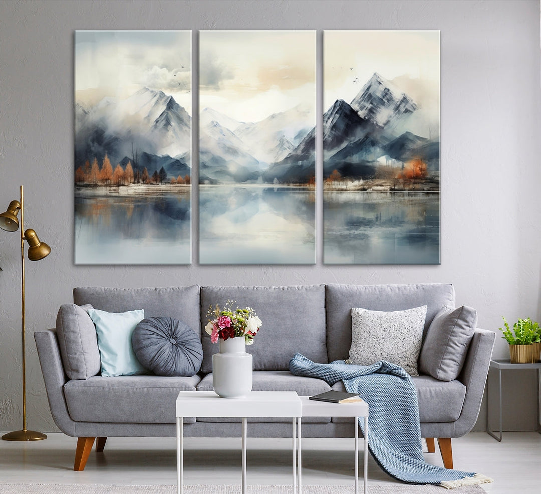 The Lake Mountain Abstract Wall Art, featuring a serene portrayal of mountains and a tranquil lake with autumn trees, is displayed on museum-quality canvas and enhanced by UV-protective coating.