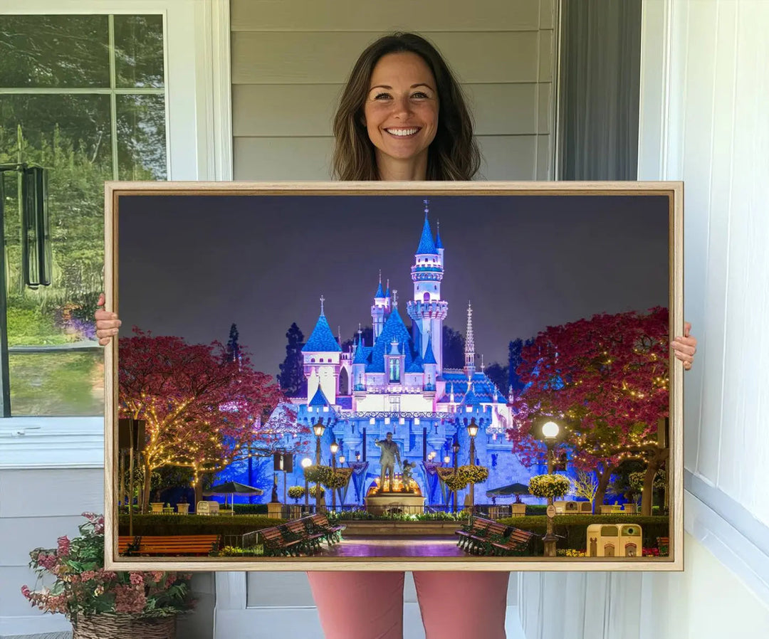 The Large Disney Castle Canvas Print captures a brightly lit castle at night.