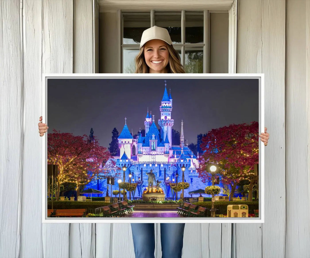 The Large Disney Castle Canvas Print captures a brightly lit castle at night.