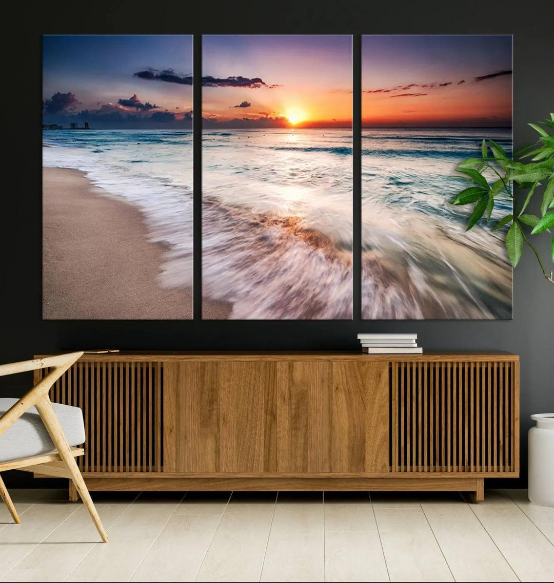 A serene triptych titled "Large Ocean Sunset Canvas Wall Art" features waves gently crashing under a golden reflection. This beach waves art print enhances the room's seaside ambiance.