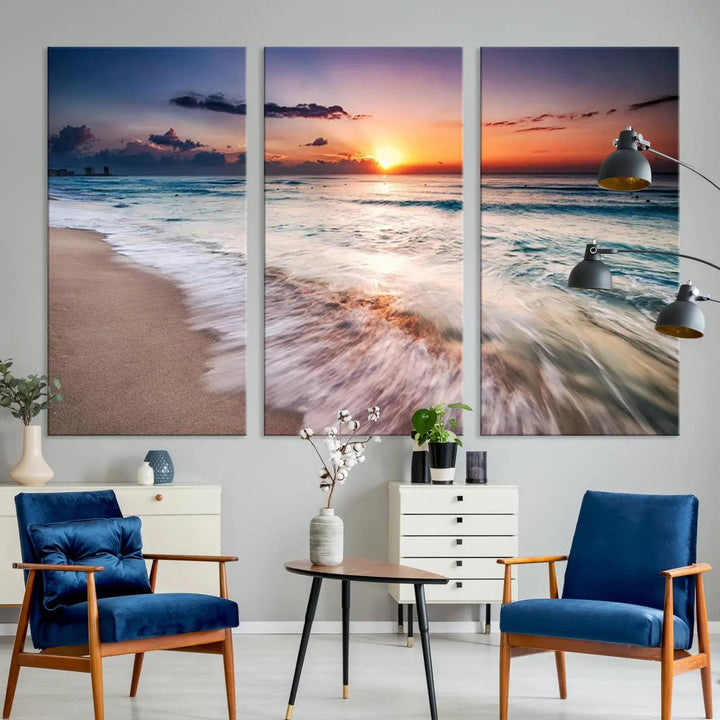 A serene triptych titled "Large Ocean Sunset Canvas Wall Art" features waves gently crashing under a golden reflection. This beach waves art print enhances the room's seaside ambiance.