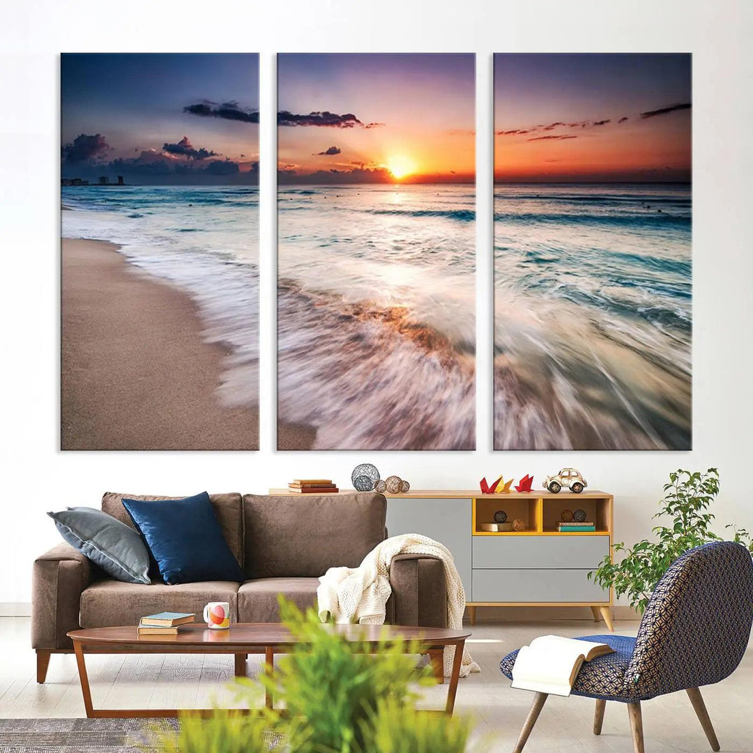 A serene triptych titled "Large Ocean Sunset Canvas Wall Art" features waves gently crashing under a golden reflection. This beach waves art print enhances the room's seaside ambiance.