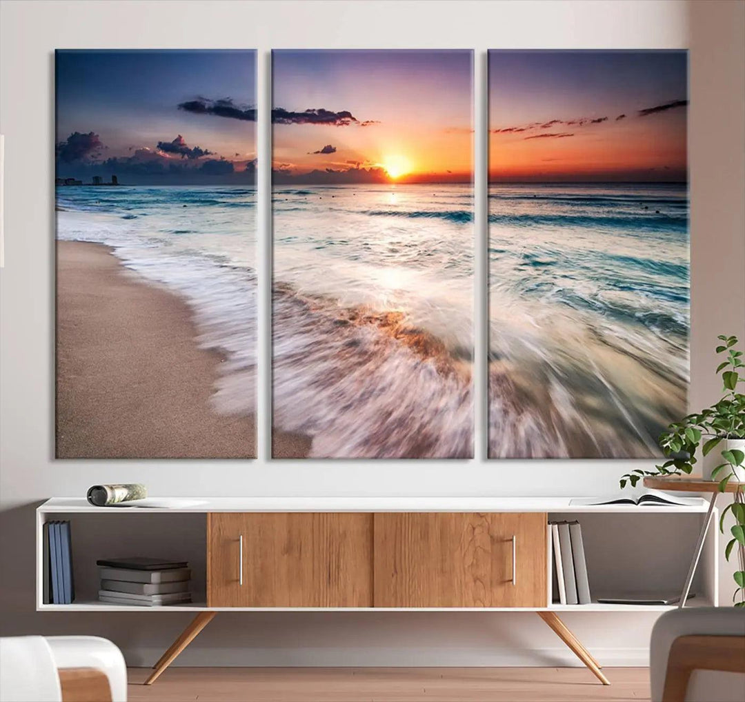 A serene triptych titled "Large Ocean Sunset Canvas Wall Art" features waves gently crashing under a golden reflection. This beach waves art print enhances the room's seaside ambiance.