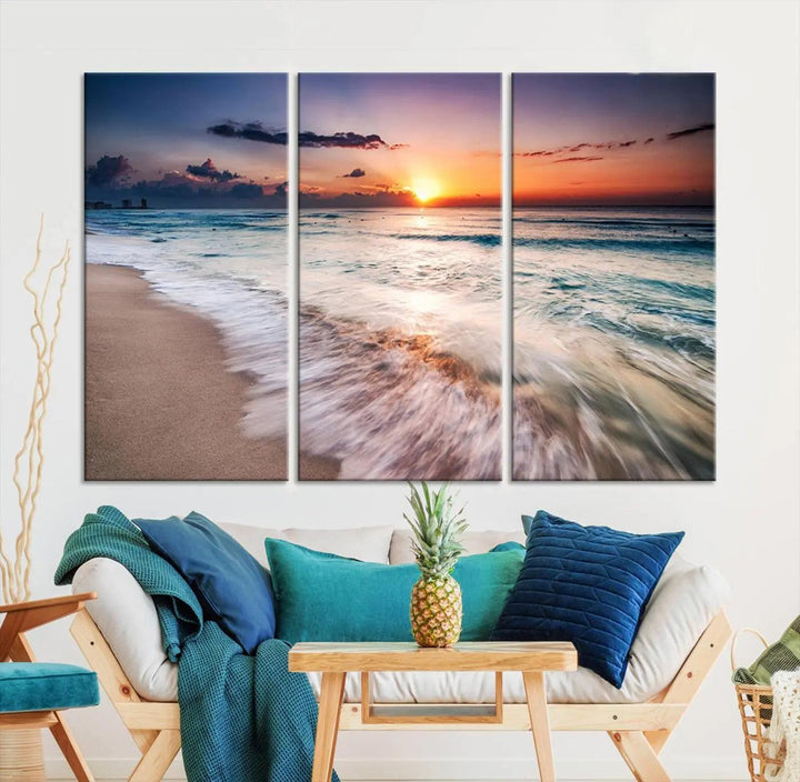 A serene triptych titled "Large Ocean Sunset Canvas Wall Art" features waves gently crashing under a golden reflection. This beach waves art print enhances the room's seaside ambiance.