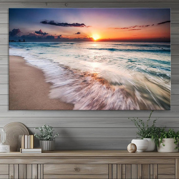 A serene triptych titled "Large Ocean Sunset Canvas Wall Art" features waves gently crashing under a golden reflection. This beach waves art print enhances the room's seaside ambiance.