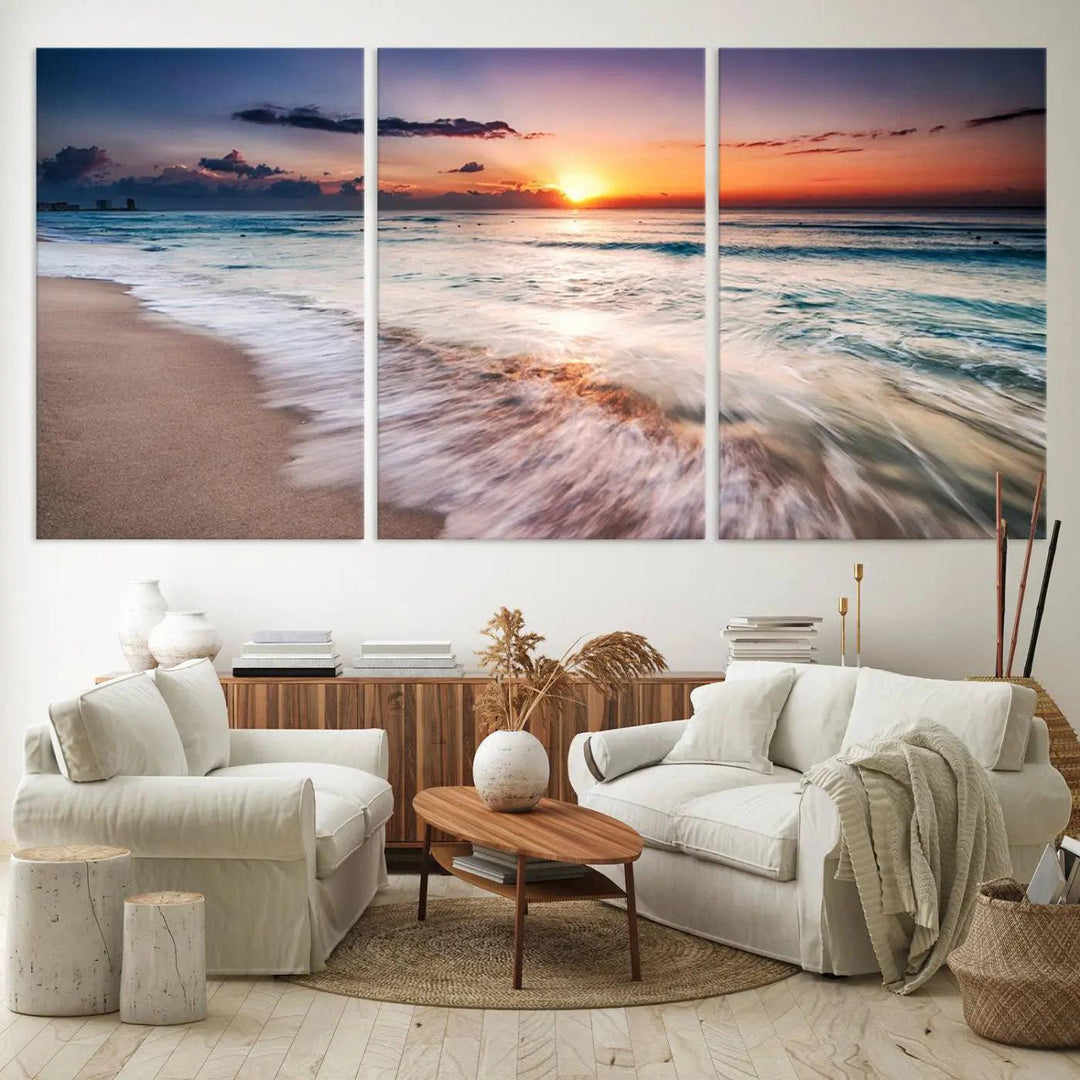 A serene triptych titled "Large Ocean Sunset Canvas Wall Art" features waves gently crashing under a golden reflection. This beach waves art print enhances the room's seaside ambiance.