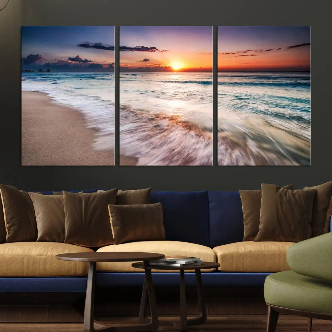 A serene triptych titled "Large Ocean Sunset Canvas Wall Art" features waves gently crashing under a golden reflection. This beach waves art print enhances the room's seaside ambiance.