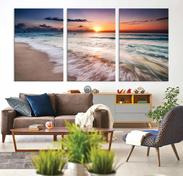 A serene triptych titled "Large Ocean Sunset Canvas Wall Art" features waves gently crashing under a golden reflection. This beach waves art print enhances the room's seaside ambiance.