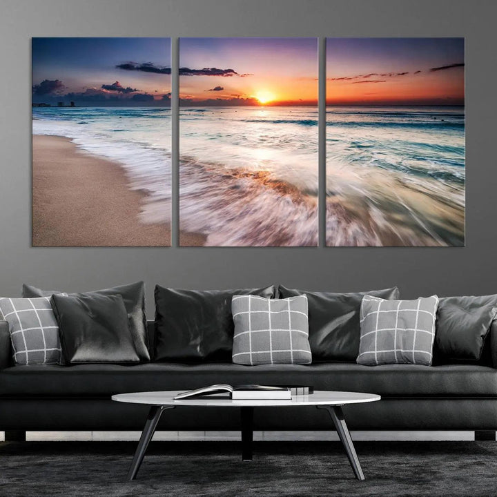 A serene triptych titled "Large Ocean Sunset Canvas Wall Art" features waves gently crashing under a golden reflection. This beach waves art print enhances the room's seaside ambiance.