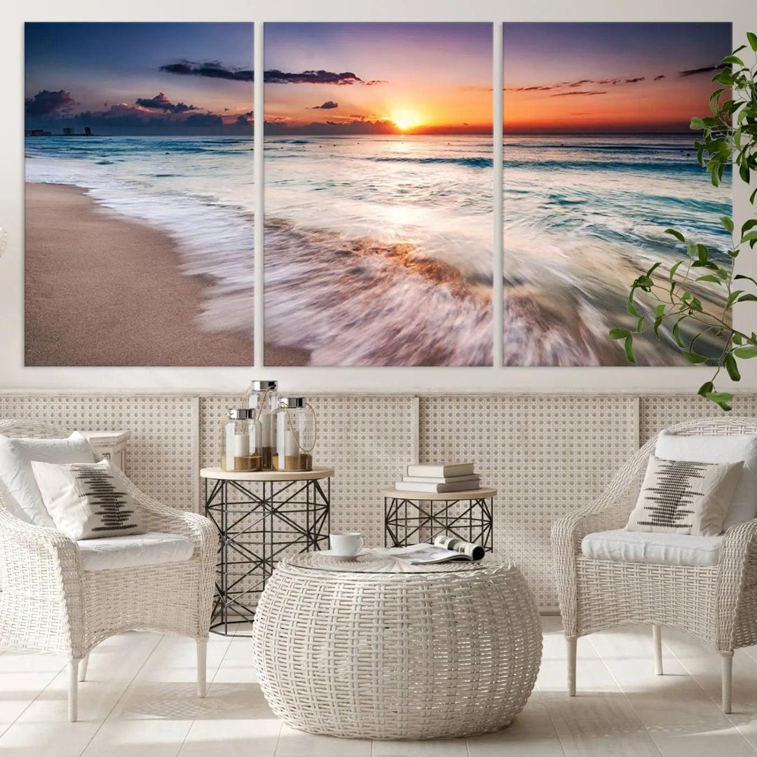 A serene triptych titled "Large Ocean Sunset Canvas Wall Art" features waves gently crashing under a golden reflection. This beach waves art print enhances the room's seaside ambiance.