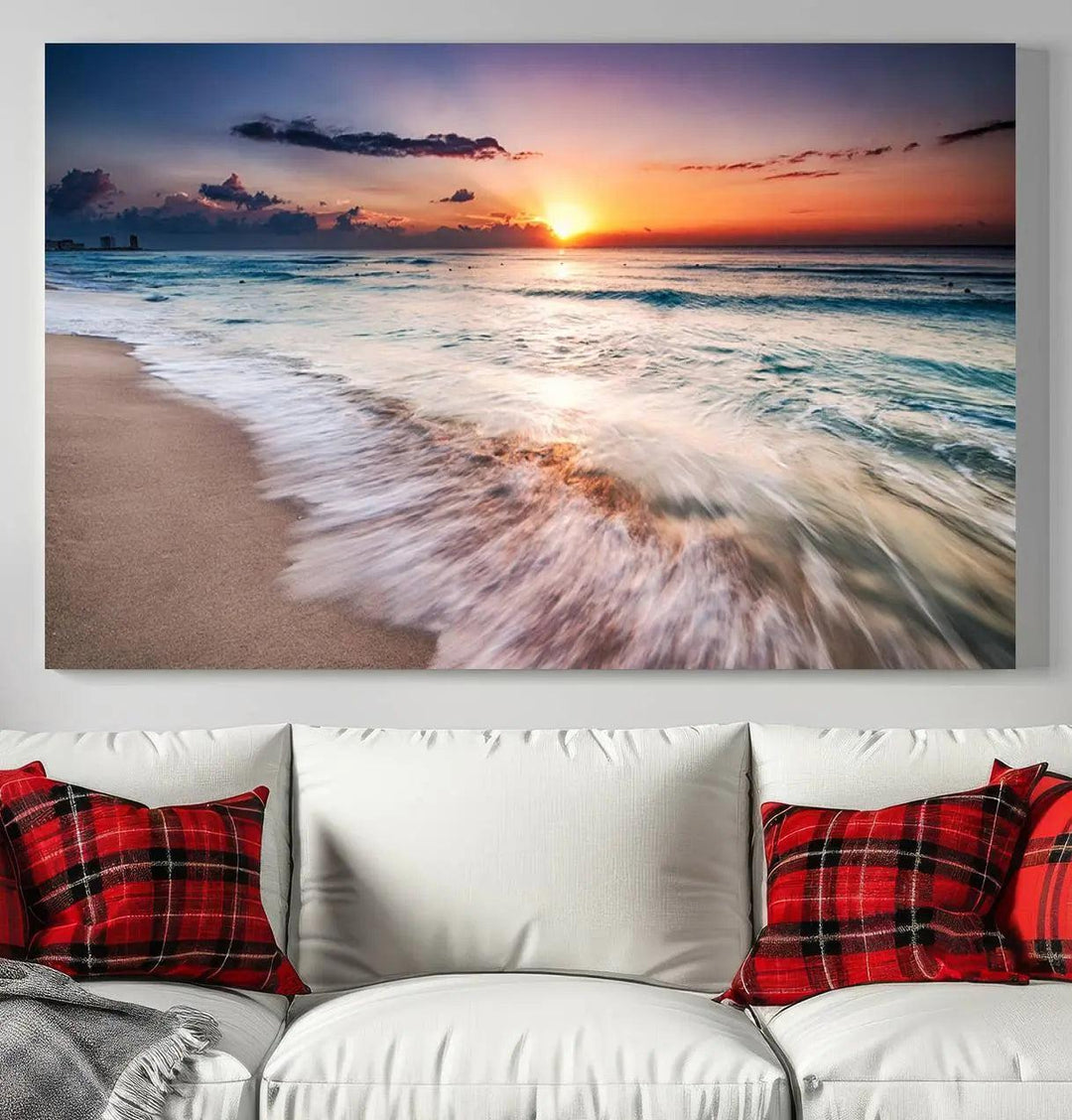 A serene triptych titled "Large Ocean Sunset Canvas Wall Art" features waves gently crashing under a golden reflection. This beach waves art print enhances the room's seaside ambiance.