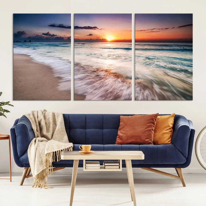 A serene triptych titled "Large Ocean Sunset Canvas Wall Art" features waves gently crashing under a golden reflection. This beach waves art print enhances the room's seaside ambiance.