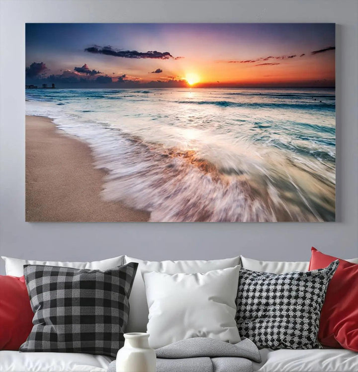 A serene triptych titled "Large Ocean Sunset Canvas Wall Art" features waves gently crashing under a golden reflection. This beach waves art print enhances the room's seaside ambiance.