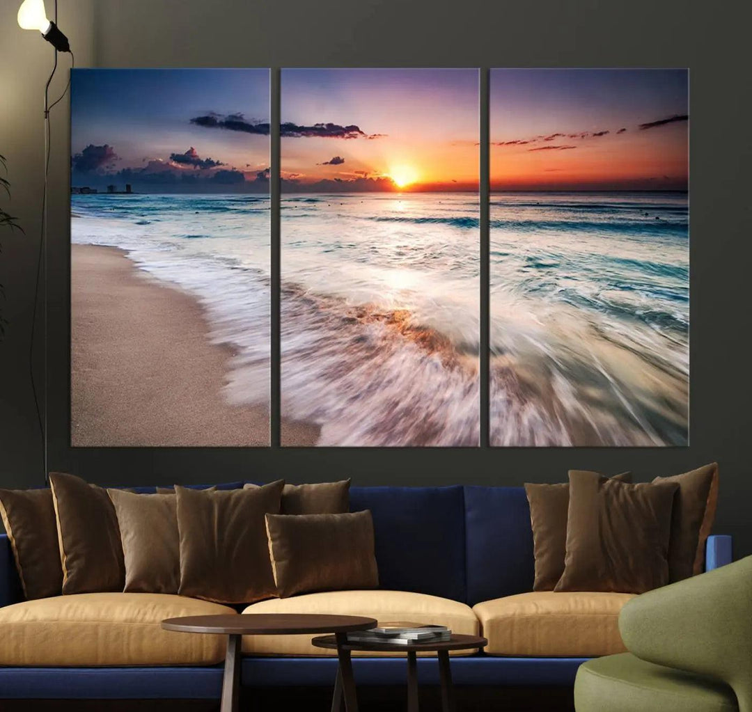 A serene triptych titled "Large Ocean Sunset Canvas Wall Art" features waves gently crashing under a golden reflection. This beach waves art print enhances the room's seaside ambiance.