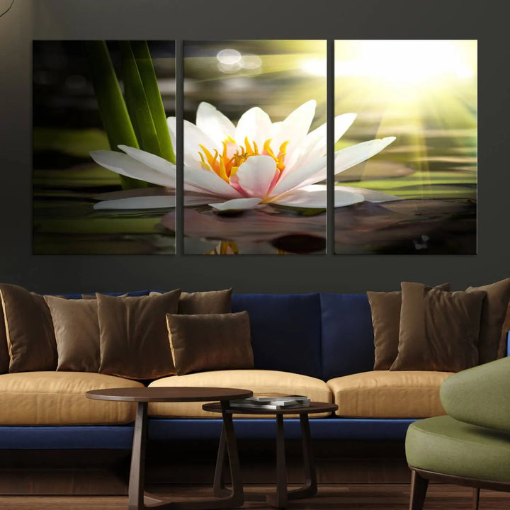 A serene Lotus Flower Wall Art Canvas Print depicts a water lily with sun rays, beautifully displayed on a light-colored wall.