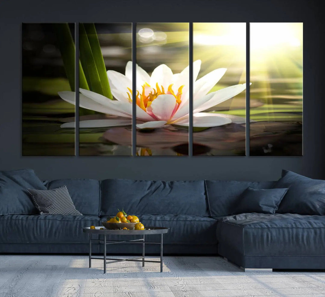 A serene Lotus Flower Wall Art Canvas Print depicts a water lily with sun rays, beautifully displayed on a light-colored wall.