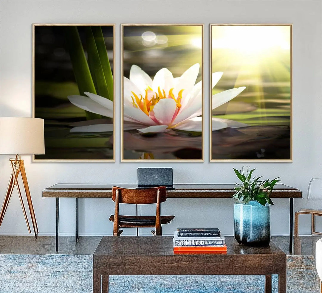 A serene Lotus Flower Wall Art Canvas Print depicts a water lily with sun rays, beautifully displayed on a light-colored wall.