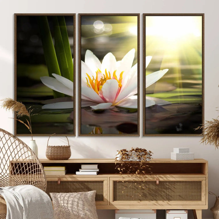 A serene Lotus Flower Wall Art Canvas Print depicts a water lily with sun rays, beautifully displayed on a light-colored wall.