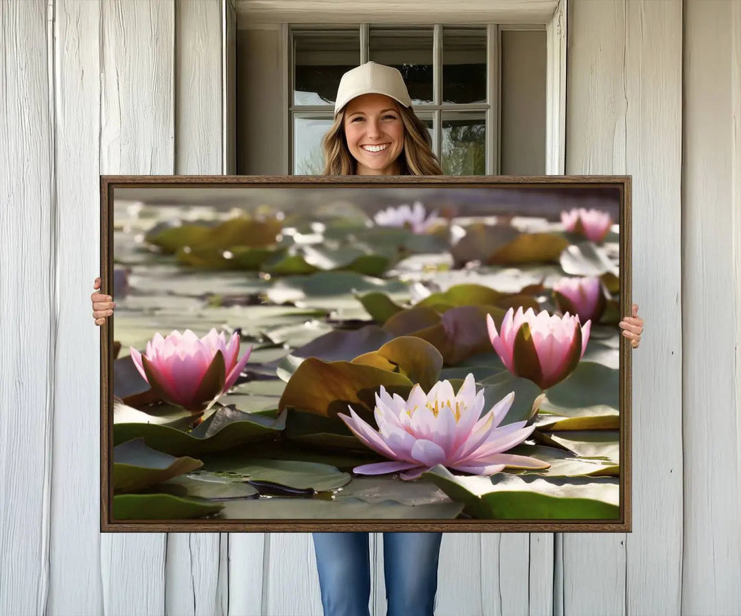 A dining room with a Lotus Flower Wall Art Canvas Print featuring pink water lilies.