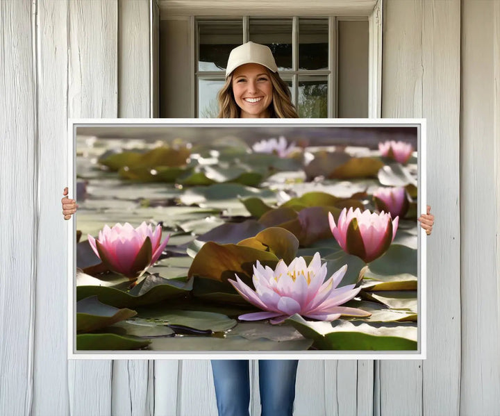 A dining room with a Lotus Flower Wall Art Canvas Print featuring pink water lilies.