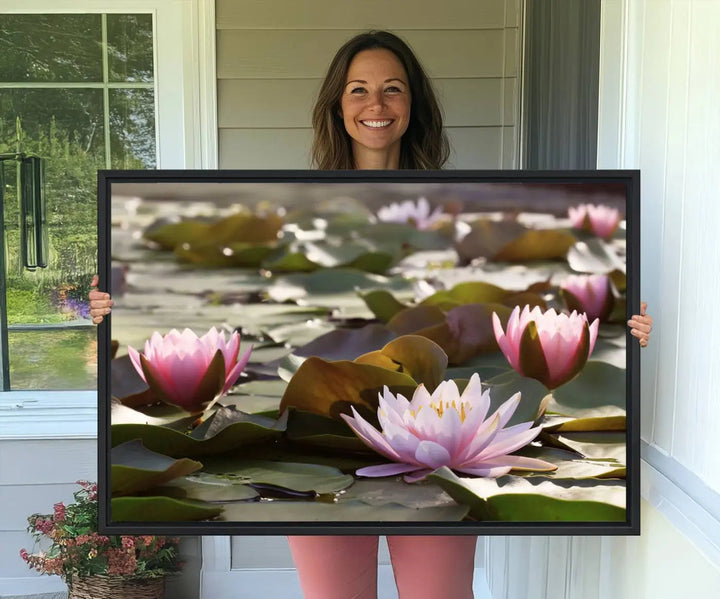 A dining room with a Lotus Flower Wall Art Canvas Print featuring pink water lilies.